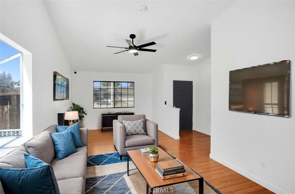 1012 Lightcap Street Lancaster, CA 93535 - Photo 9 of 33 a living room with furniture and a flat screen tv