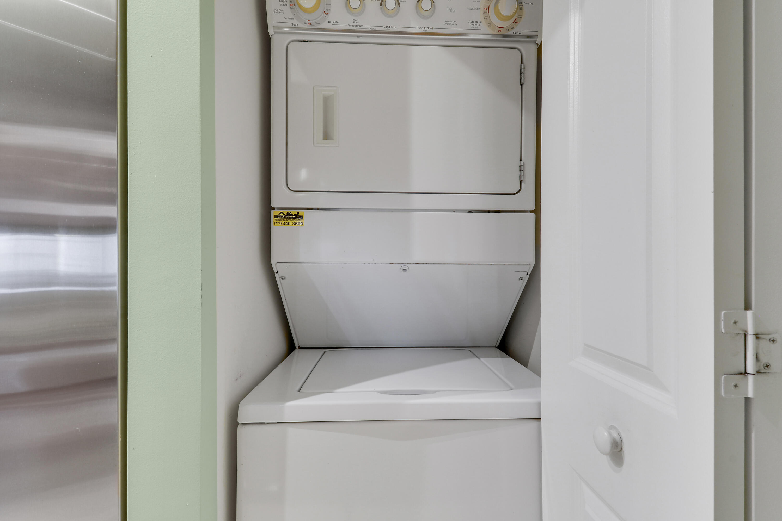 875 Northwest Flagler Avenue, Unit 401 Stuart, FL 34994 - Photo 11 of 36 a utility room with dryer and washer