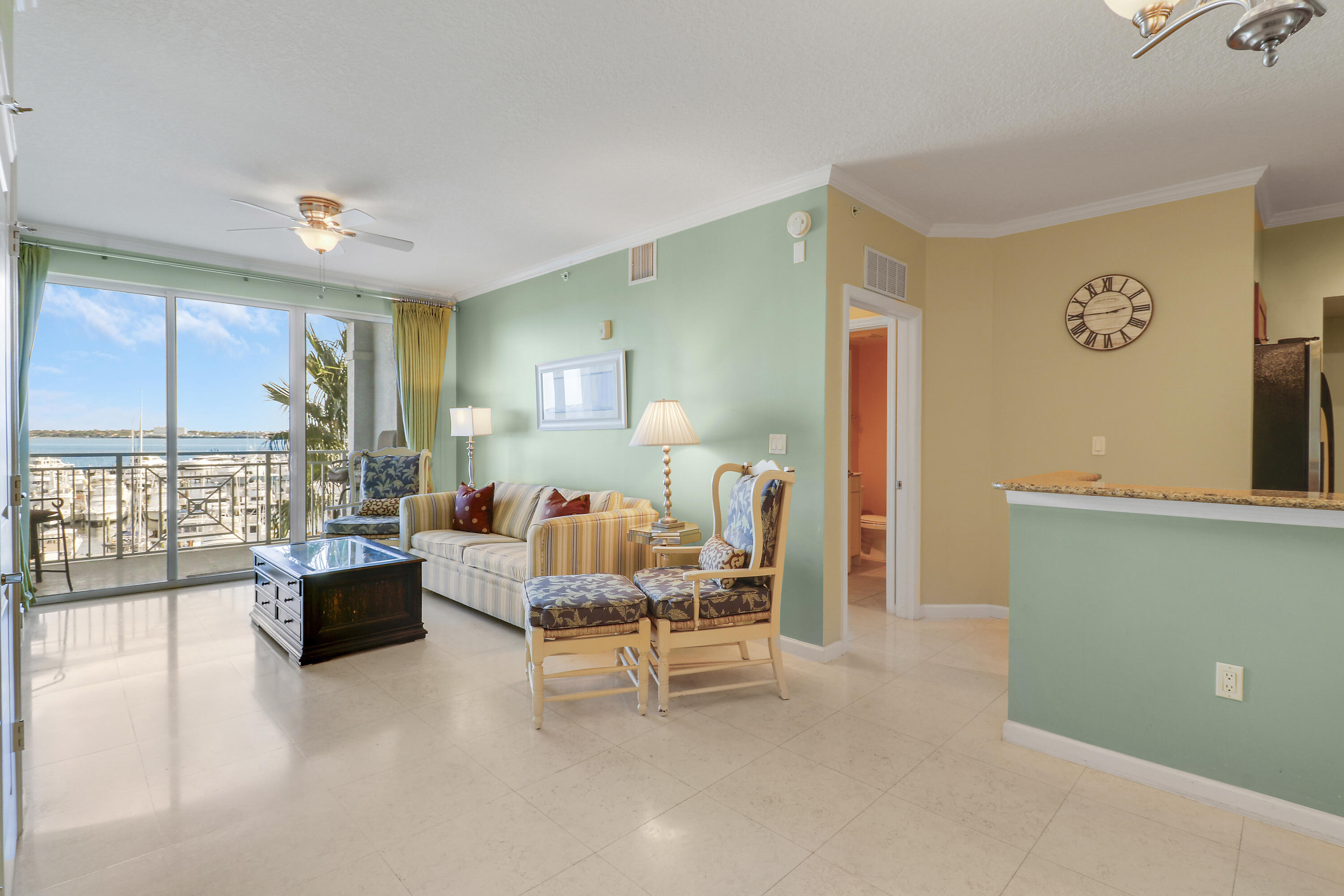 875 Northwest Flagler Avenue, Unit 401 Stuart, FL 34994 - Photo 12 of 36 a living room with furniture and a large window