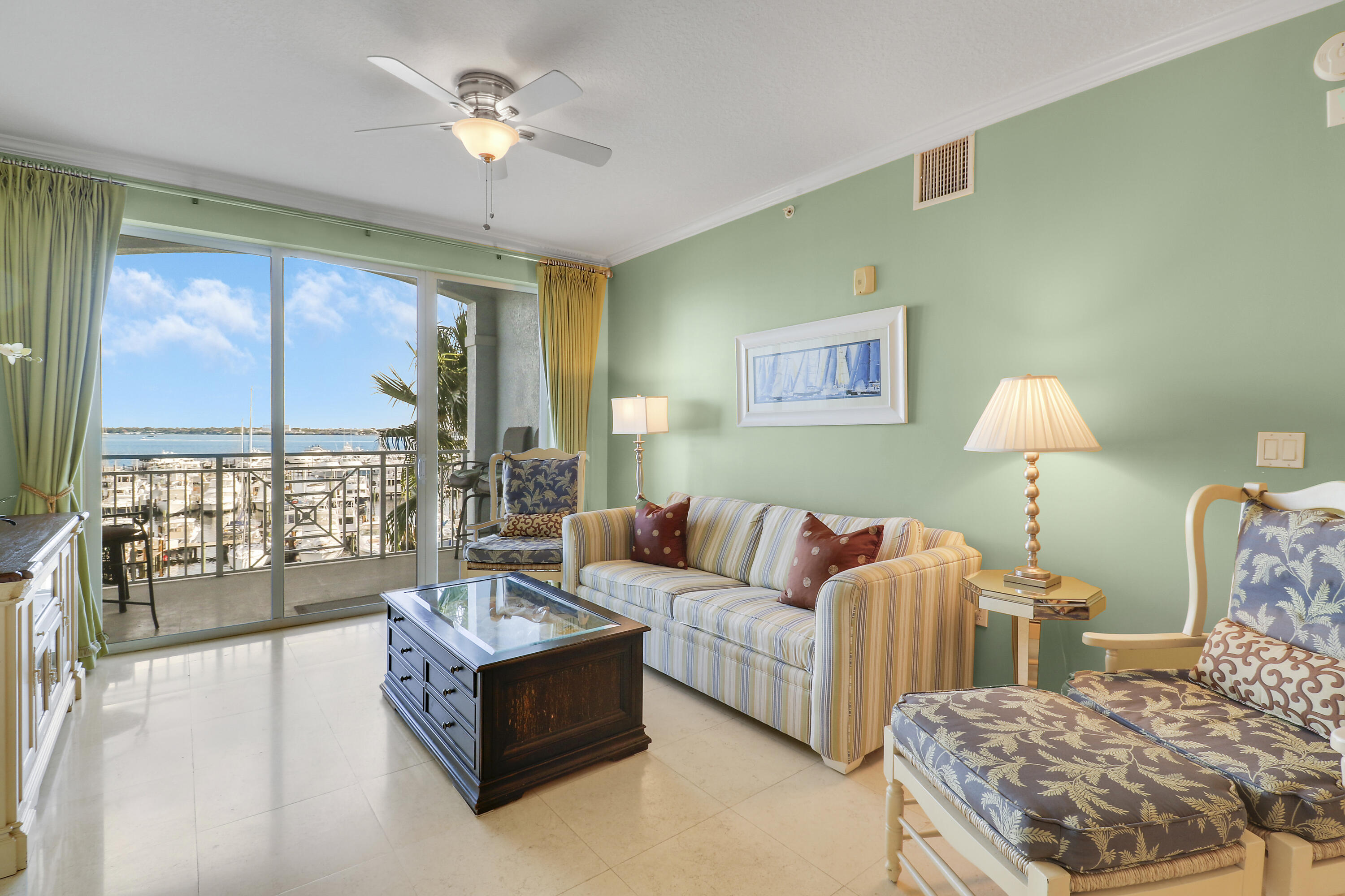 875 Northwest Flagler Avenue, Unit 401 Stuart, FL 34994 - Photo 14 of 36 a living room with furniture and a large window
