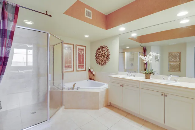 a bathroom with a double vanity sink mirror and double