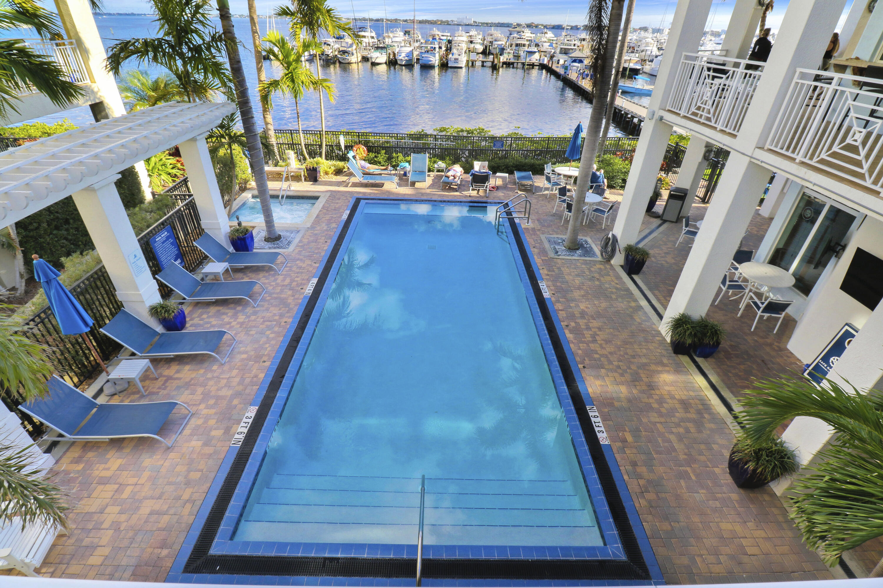 875 Northwest Flagler Avenue, Unit 401 Stuart, FL 34994 - Photo 31 of 36 a view of a backyard with sitting area