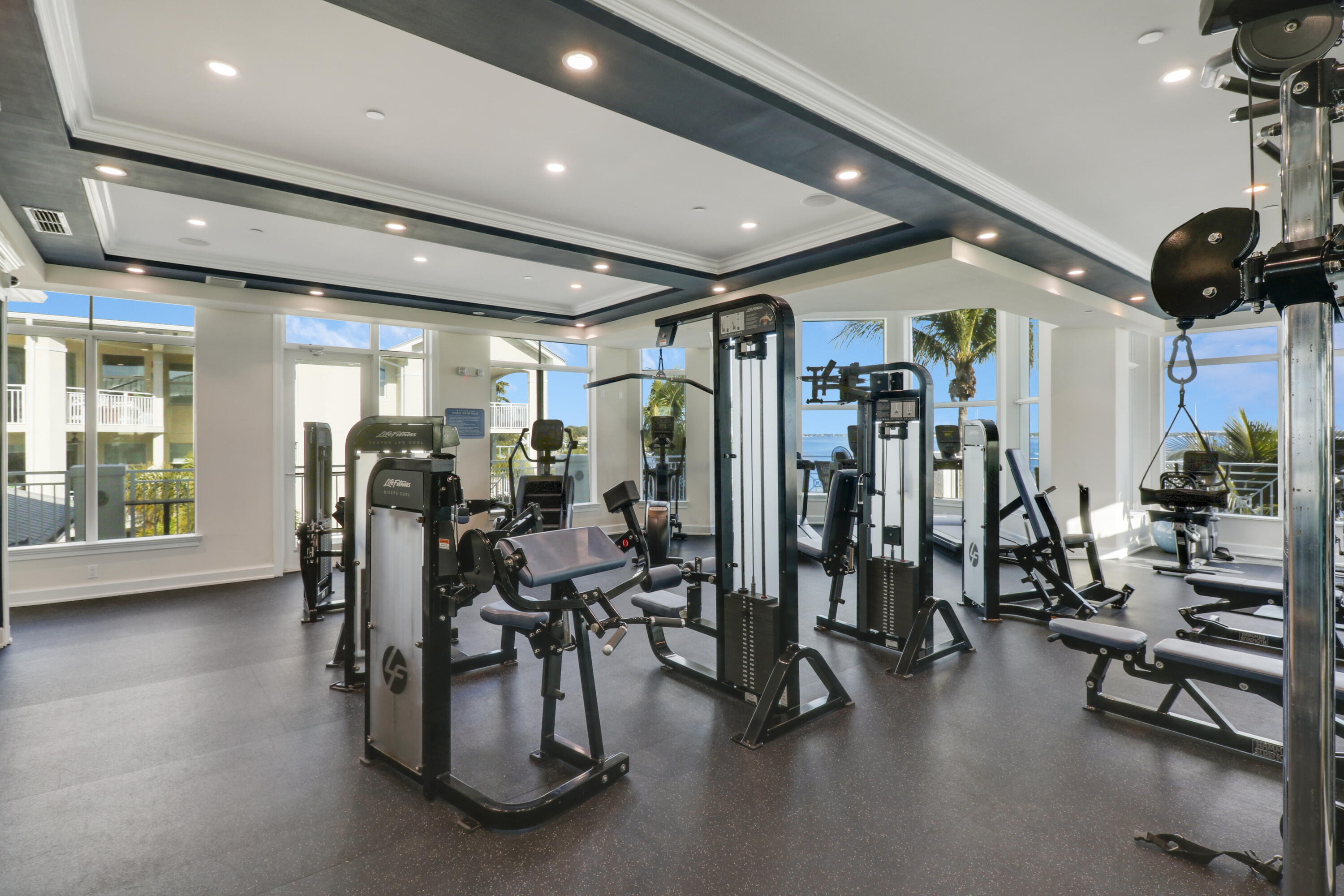 875 Northwest Flagler Avenue, Unit 401 Stuart, FL 34994 - Photo 32 of 36 a view of a room with gym equipment