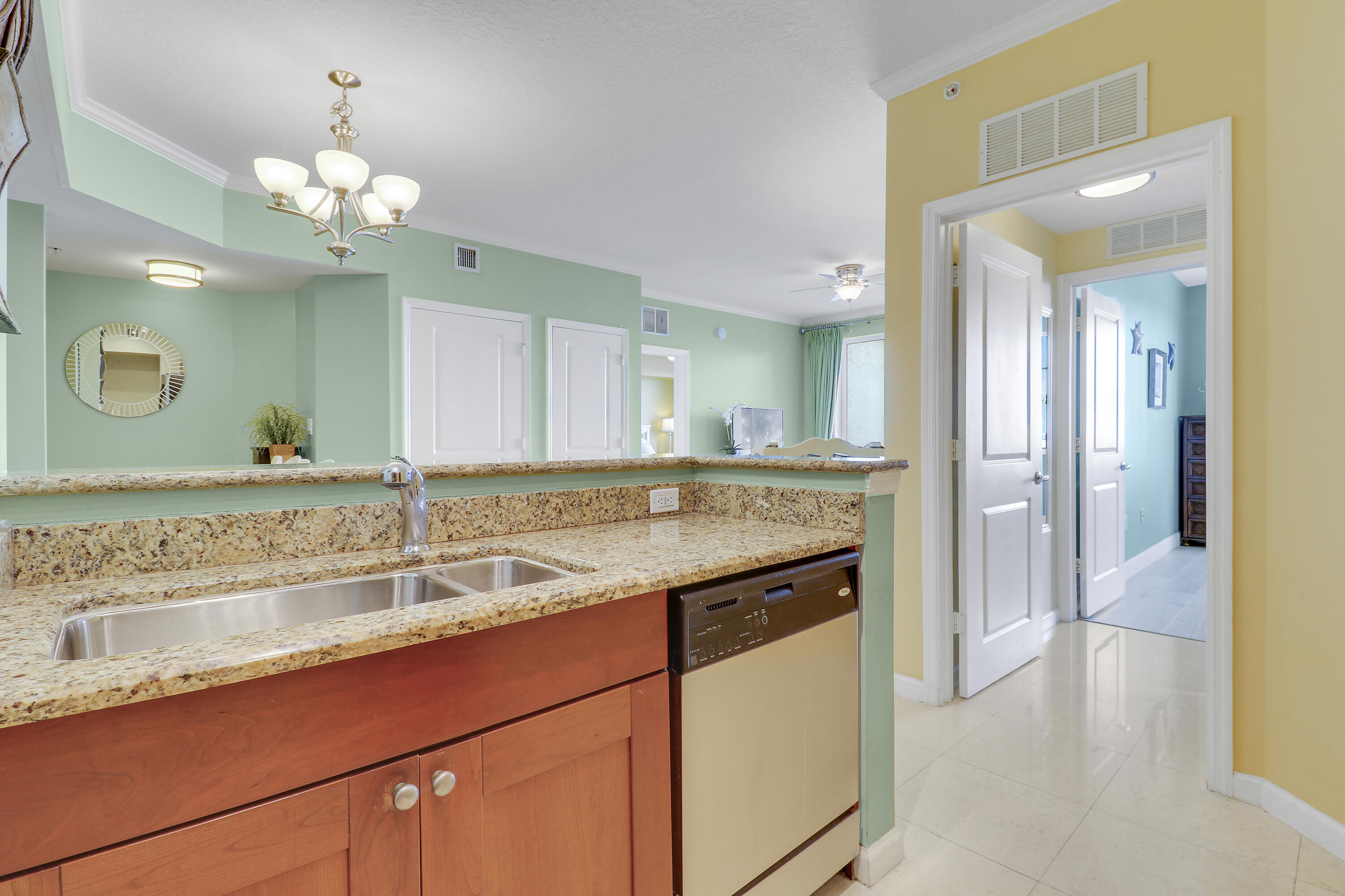 875 Northwest Flagler Avenue, Unit 401 Stuart, FL 34994 - Photo 8 of 36 a bathroom with a sink a vanity and a mirror