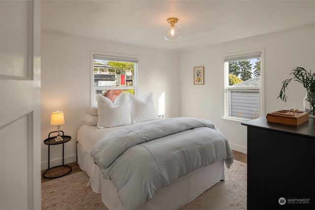 a bedroom with a bed and a night stand