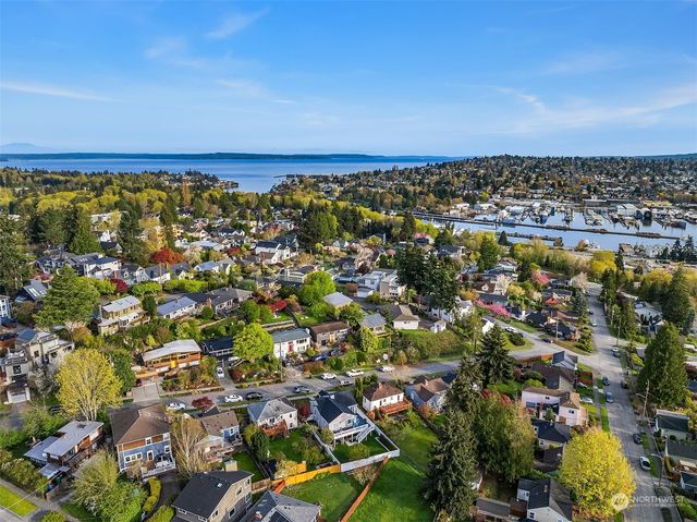 an aerial view of multiple house with a swimming pool