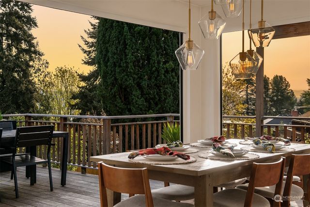 a view of a dinning tables and chairs in a patio