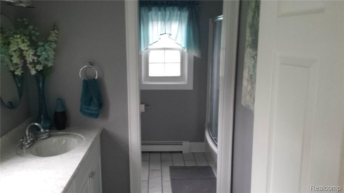 9772 Bryce Road Avoca, MI 48006 - Photo 11 of 26 This is a view of the main bath.