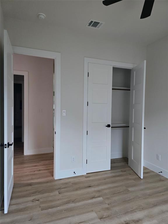 808 N Avenue East Springtown, TX 76082 - Photo 19 of 21 an empty room with wooden floor and closet