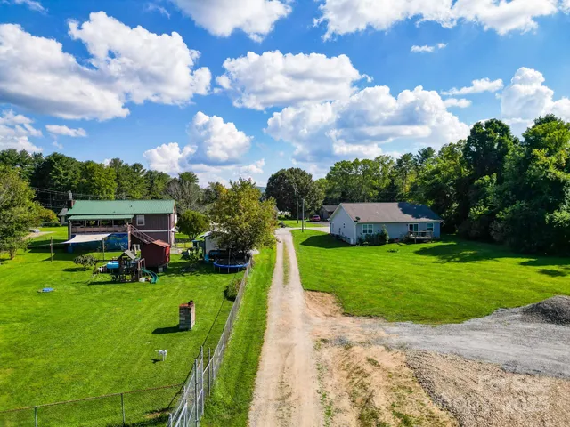 a view of a garden with houses