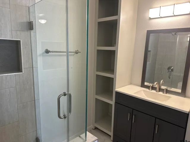 a bathroom with a sink and a mirror