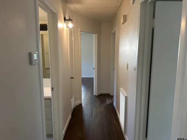 a view of a bathroom from a hallway