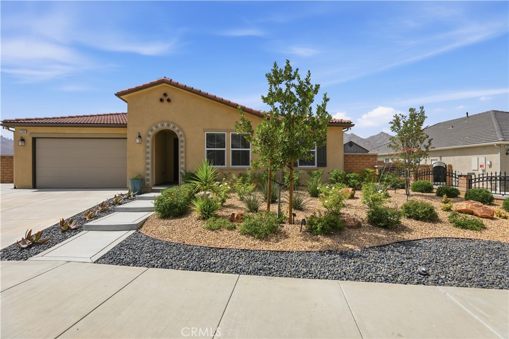 21159 Blue Jeans Court Riverside, CA 92507 - Photo 6 of 63 a front view of a house with garden
