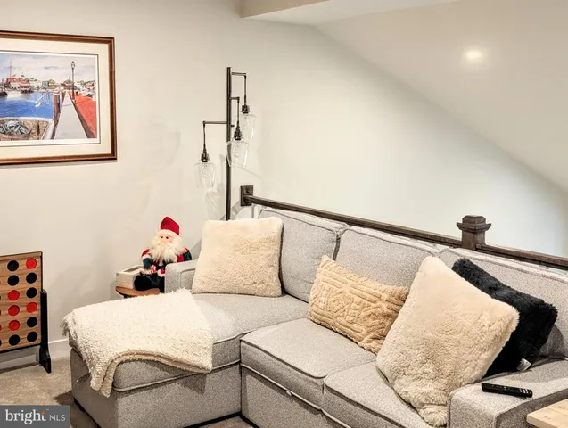 a bedroom with a bed and a chair