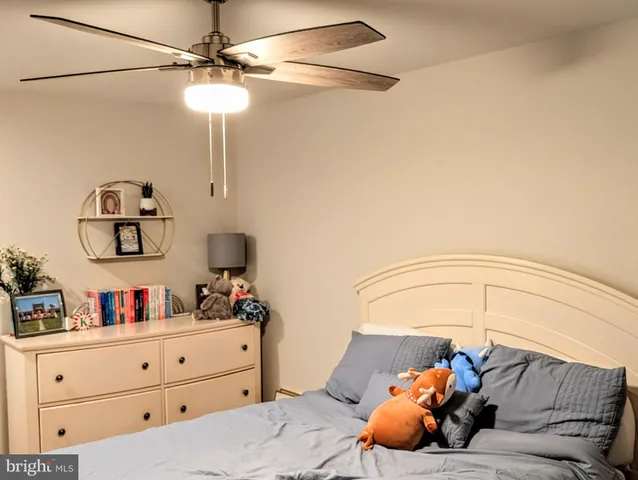 a bathroom with a sink a toilet and a shower curtain