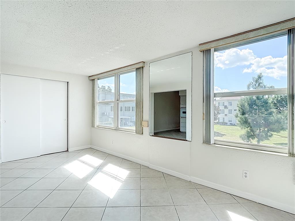 2461 Canadian Way, Unit 45 Clearwater, FL 33763 - Photo 14 of 33 a view of an empty room with a window