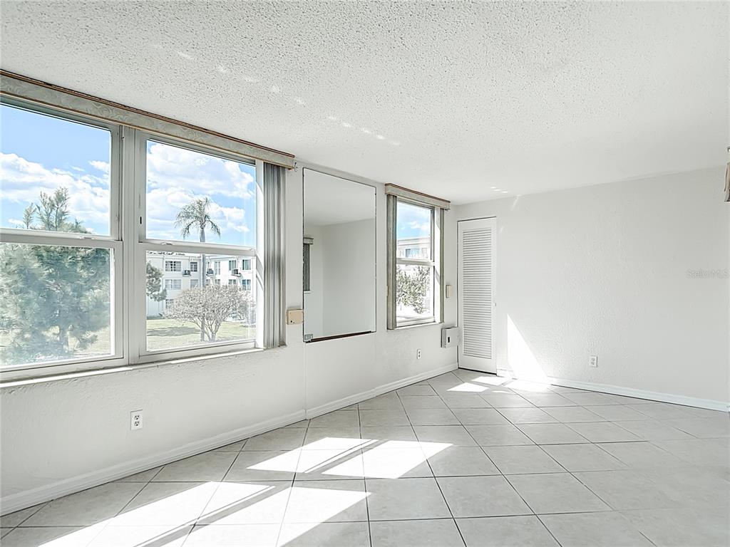 2461 Canadian Way, Unit 45 Clearwater, FL 33763 - Photo 15 of 33 a view of an empty room with a window