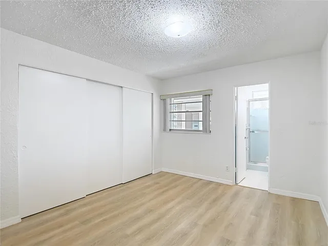 an empty room with a empty space and windows