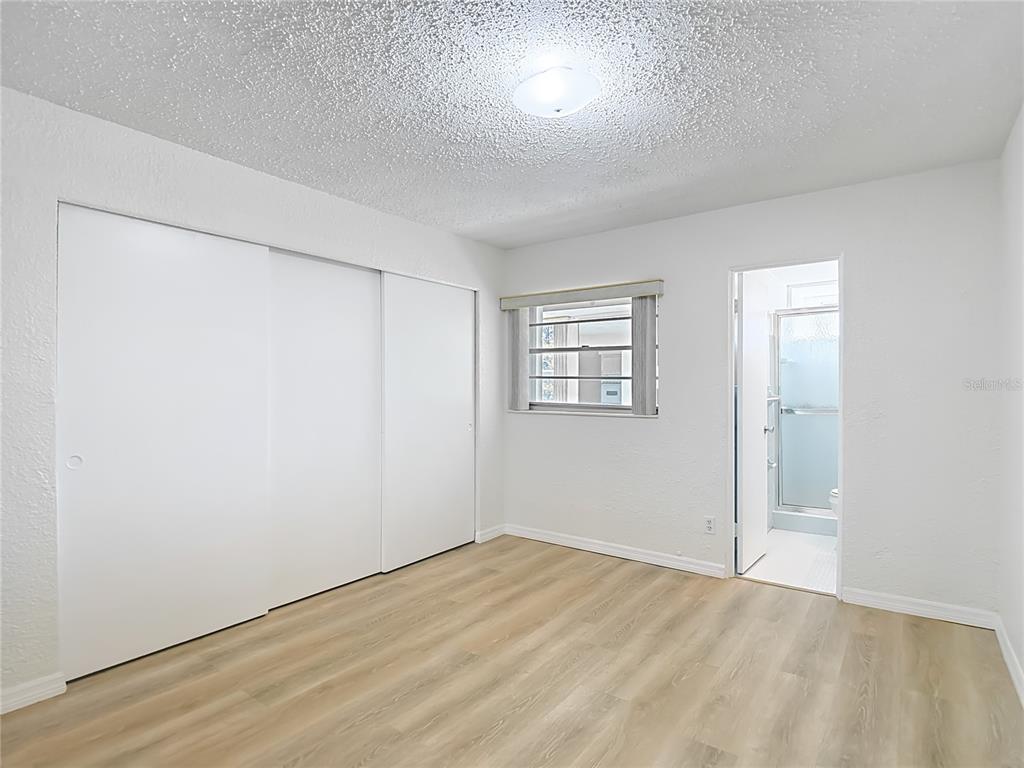 2461 Canadian Way, Unit 45 Clearwater, FL 33763 - Photo 19 of 33 an empty room with a empty space and windows