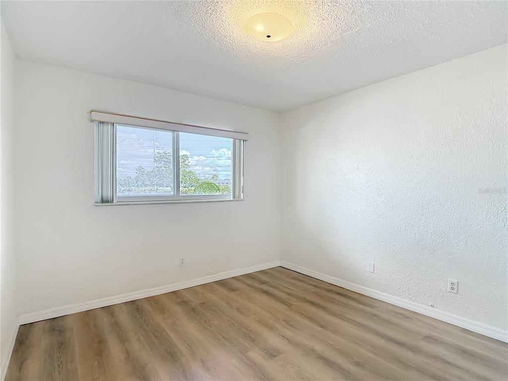 2461 Canadian Way, Unit 45 Clearwater, FL 33763 - Photo 23 of 33 an empty room with a window