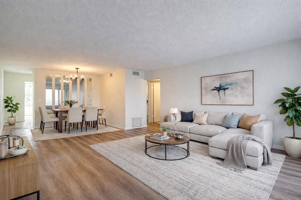 2461 Canadian Way, Unit 45 Clearwater, FL 33763 - Photo 6 of 33 a living room with furniture and wooden floor