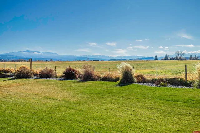 a front view of a house with a garden and porch