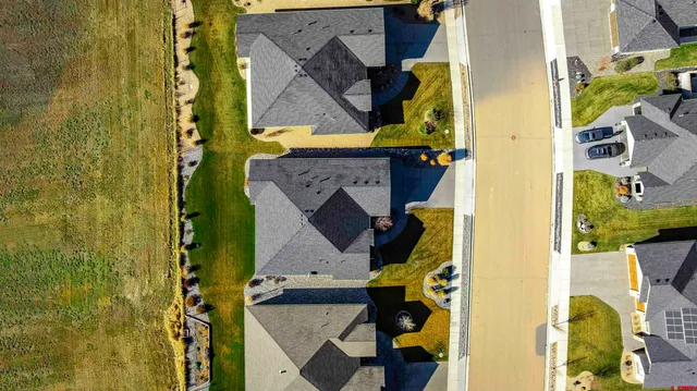 an aerial view of residential houses with outdoor space