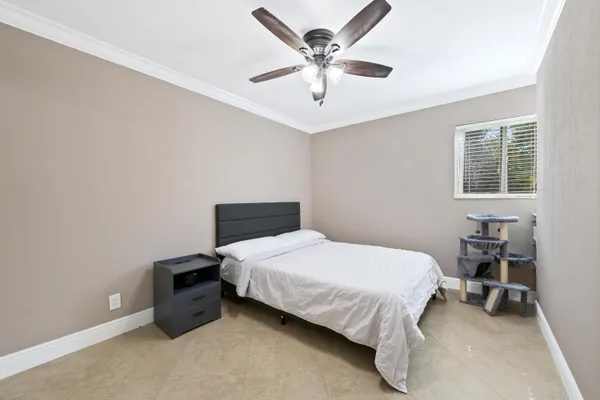an aerial view of residential houses with outdoor space and swimming pool