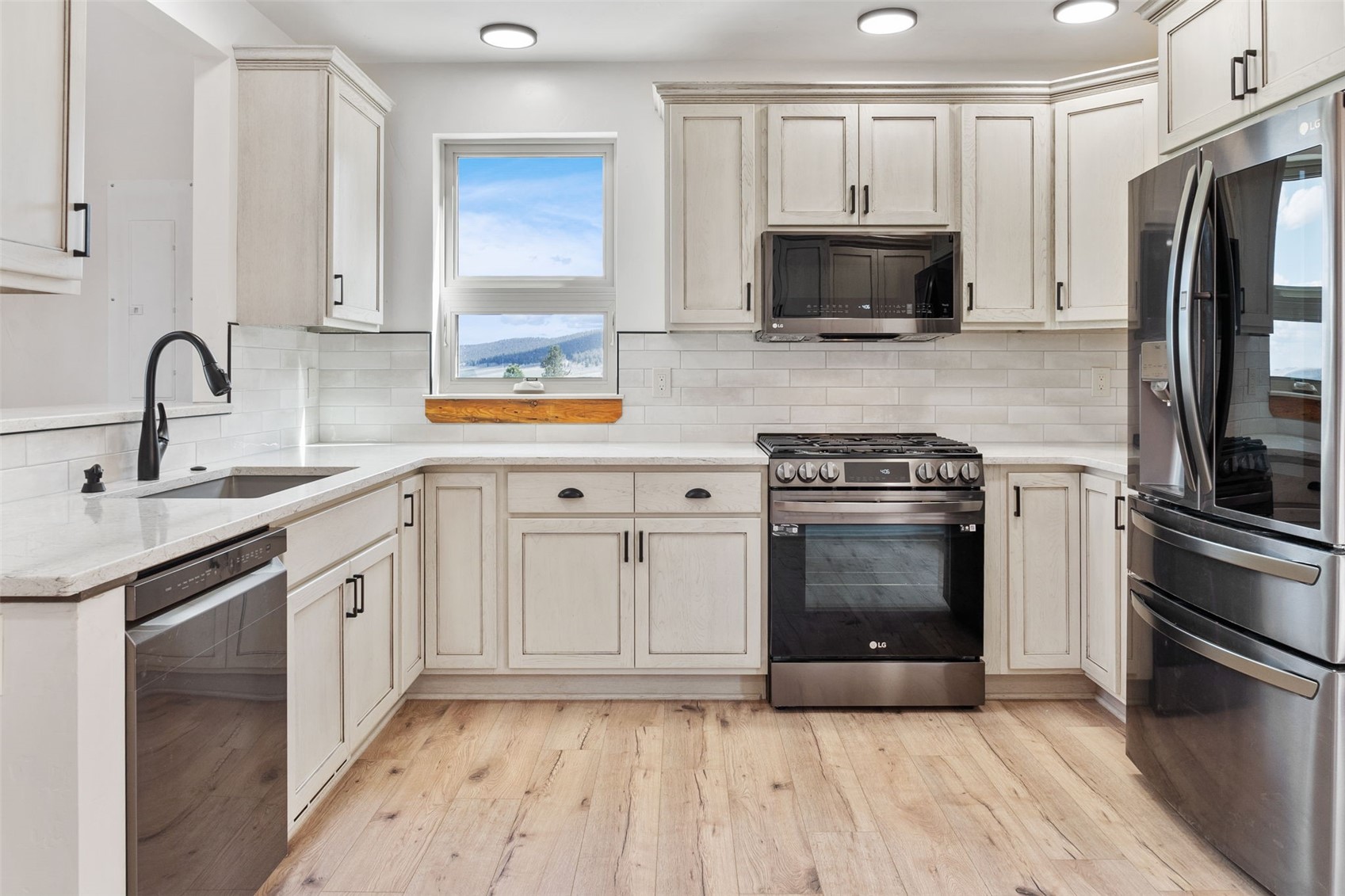 3415 Redhill Road Fairplay, CO 80440 - Photo 16 of 50 a kitchen with granite countertop a sink stove and refrigerator
