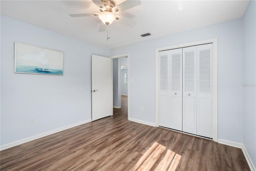 8024 Northwest 2nd Court Gainesville, FL 32607 - Photo 13 of 40 wooden floor in an empty room with a window