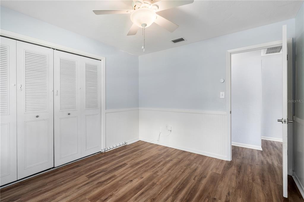 8024 Northwest 2nd Court Gainesville, FL 32607 - Photo 15 of 40 wooden floor in an empty room with a window