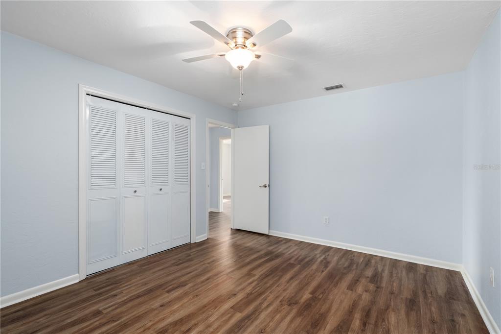 8024 Northwest 2nd Court Gainesville, FL 32607 - Photo 17 of 40 a view of an empty room with wooden floor