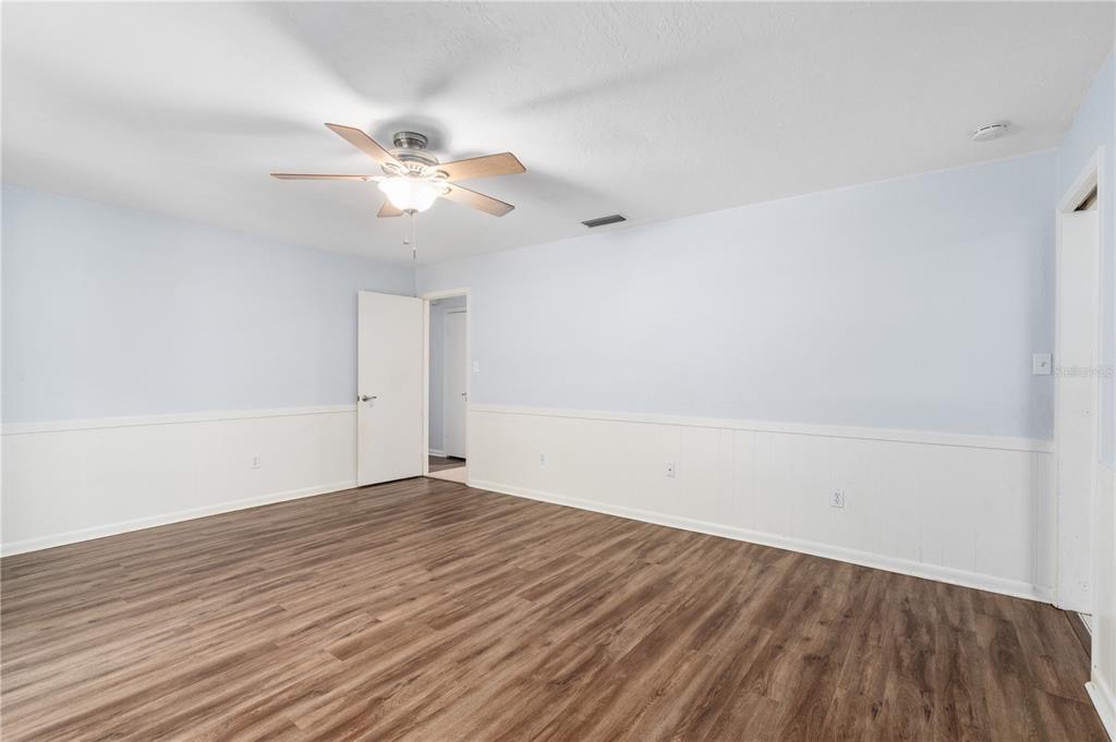 8024 Northwest 2nd Court Gainesville, FL 32607 - Photo 19 of 40 wooden floor in an empty room