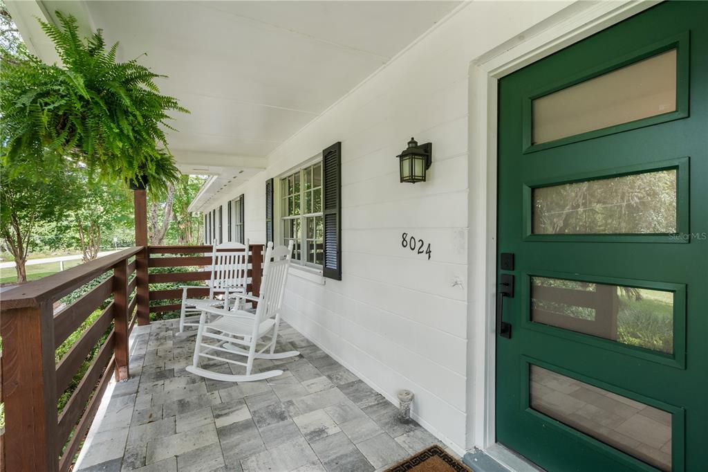 8024 Northwest 2nd Court Gainesville, FL 32607 - Photo 25 of 40 a view of balcony with two chairs and a gate