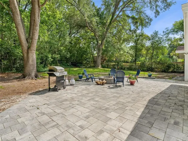 a view of backyard with sitting area