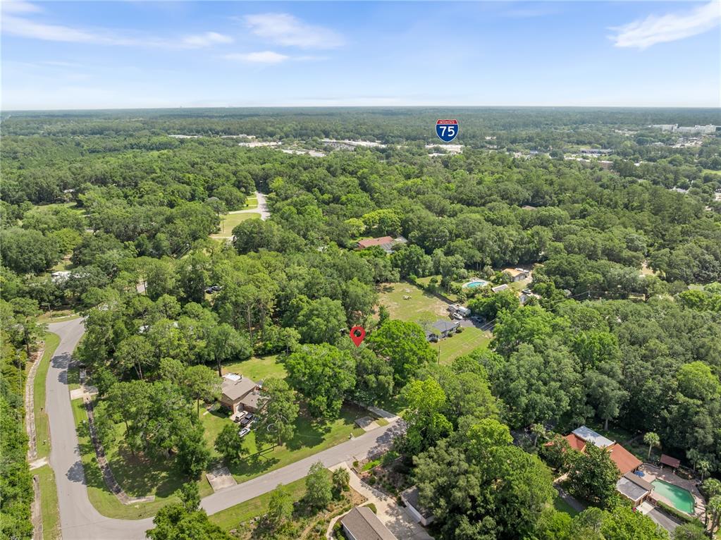 8024 Northwest 2nd Court Gainesville, FL 32607 - Photo 31 of 40 an aerial view of residential houses with outdoor space and trees