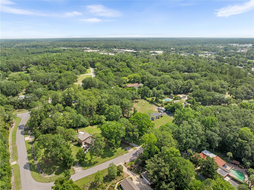 8024 Northwest 2nd Court Gainesville, FL 32607 - Photo 32 of 40 an aerial view of residential houses with outdoor space and trees