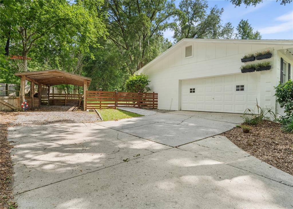 8024 Northwest 2nd Court Gainesville, FL 32607 - Photo 34 of 40 a view of a house with a yard