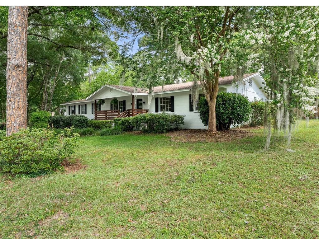 8024 Northwest 2nd Court Gainesville, FL 32607 - Photo 35 of 40 a front view of a house with garden