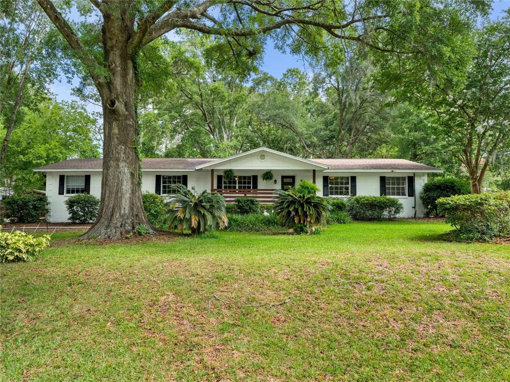 8024 Northwest 2nd Court Gainesville, FL 32607 - Photo 40 of 40 a front view of a house with a yard