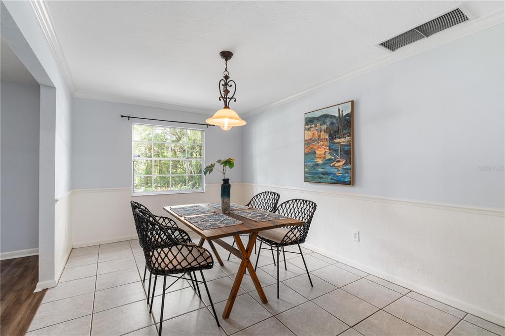 8024 Northwest 2nd Court Gainesville, FL 32607 - Photo 6 of 40 a view of a dining room with furniture and window
