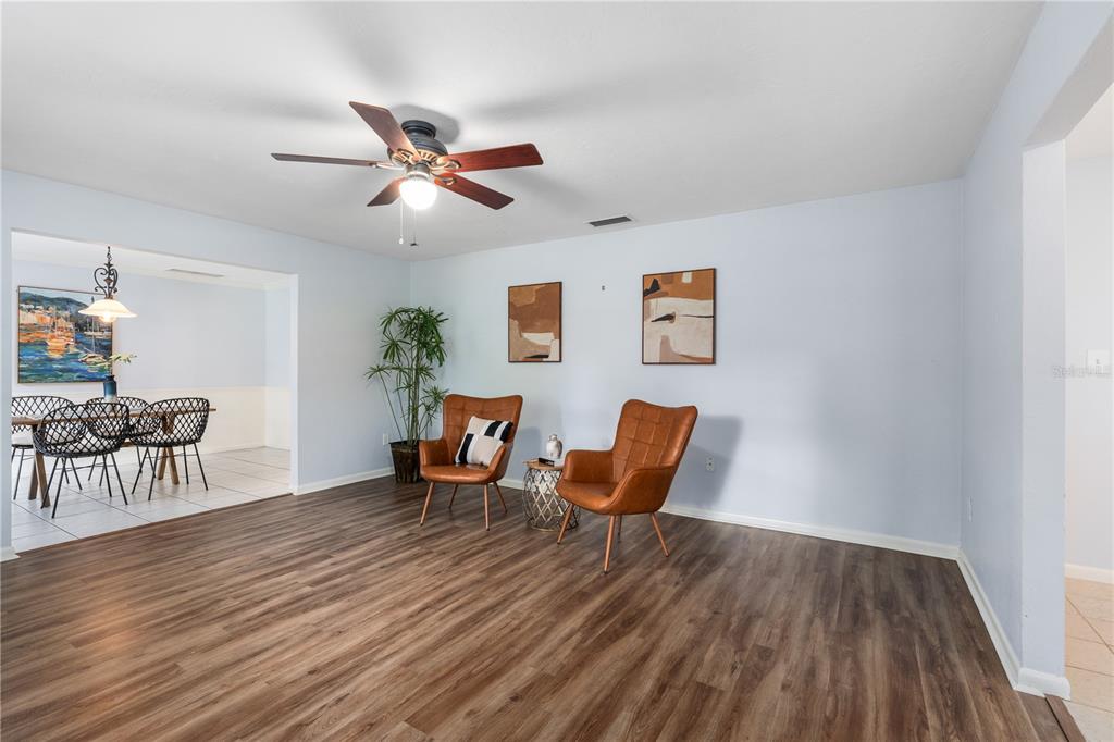 8024 Northwest 2nd Court Gainesville, FL 32607 - Photo 8 of 40 a workspace with furniture and wooden floor