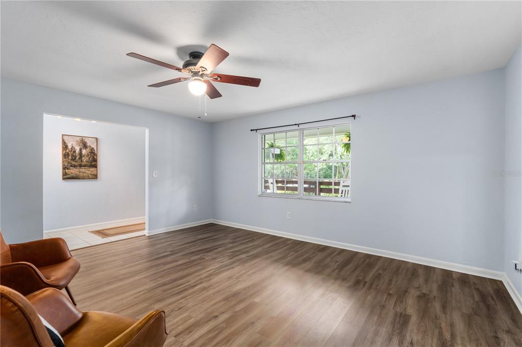 8024 Northwest 2nd Court Gainesville, FL 32607 - Photo 9 of 40 a view of livingroom with hardwood floor and ceiling fan