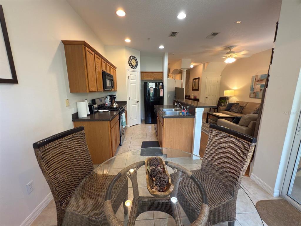 879 Assembly Court Reunion, FL 34747 - Photo 12 of 46 a view of a dining room with furniture