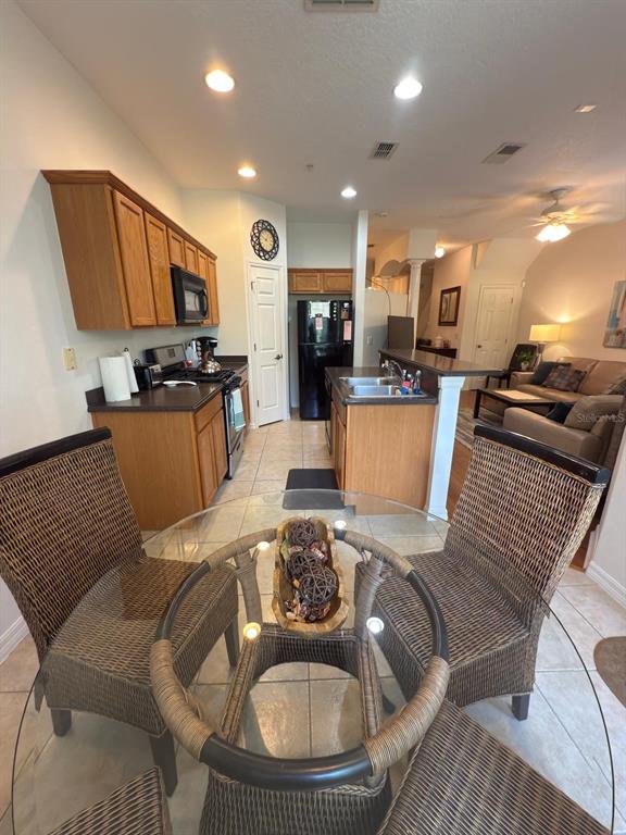 879 Assembly Court Reunion, FL 34747 - Photo 13 of 46 a living room with furniture and a flat screen tv