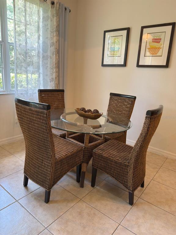 879 Assembly Court Reunion, FL 34747 - Photo 15 of 46 a view of a dining room with furniture and window