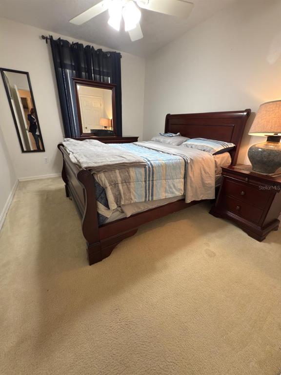 879 Assembly Court Reunion, FL 34747 - Photo 19 of 46 a bedroom with a bed and window