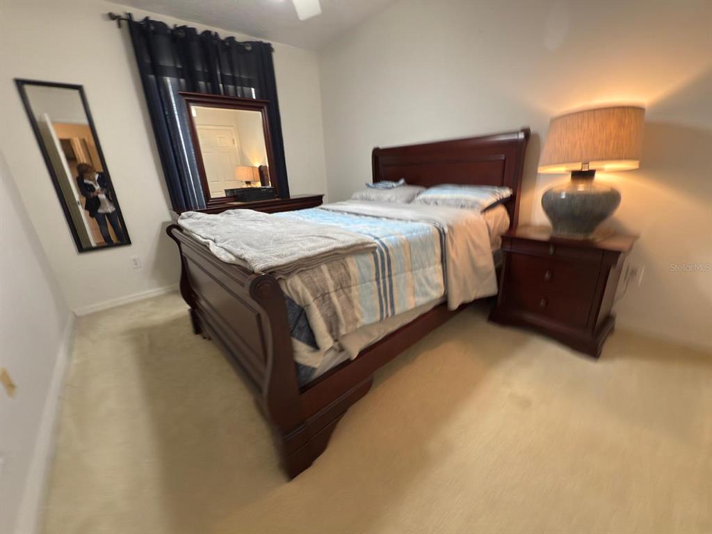 879 Assembly Court Reunion, FL 34747 - Photo 26 of 46 a bedroom with a bed and window