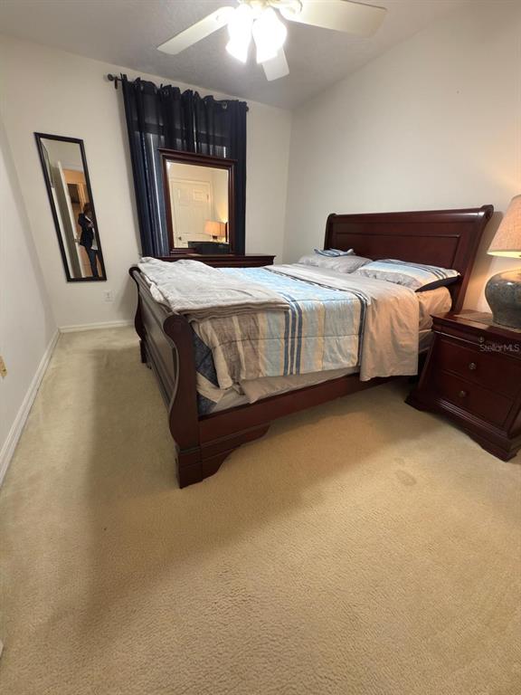 879 Assembly Court Reunion, FL 34747 - Photo 29 of 46 a bedroom with a bed window and dresser