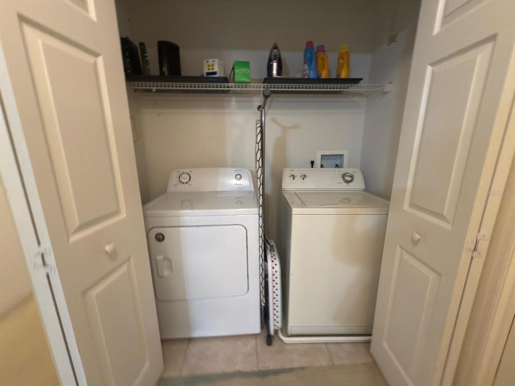 879 Assembly Court Reunion, FL 34747 - Photo 36 of 46 a utility room with dryer and washer